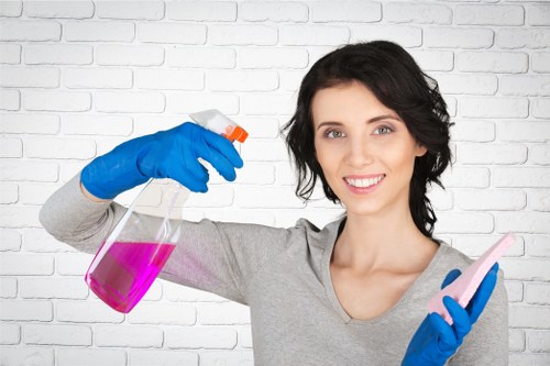 Professional carpet cleaning team working safely with equipment and protective gear